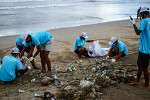 Volunteer to clean up a local beach